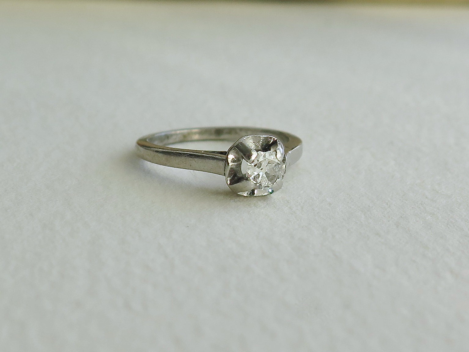 Antique Art Deco Platinum Diamond Solitaire Ring (0.25 ct)
